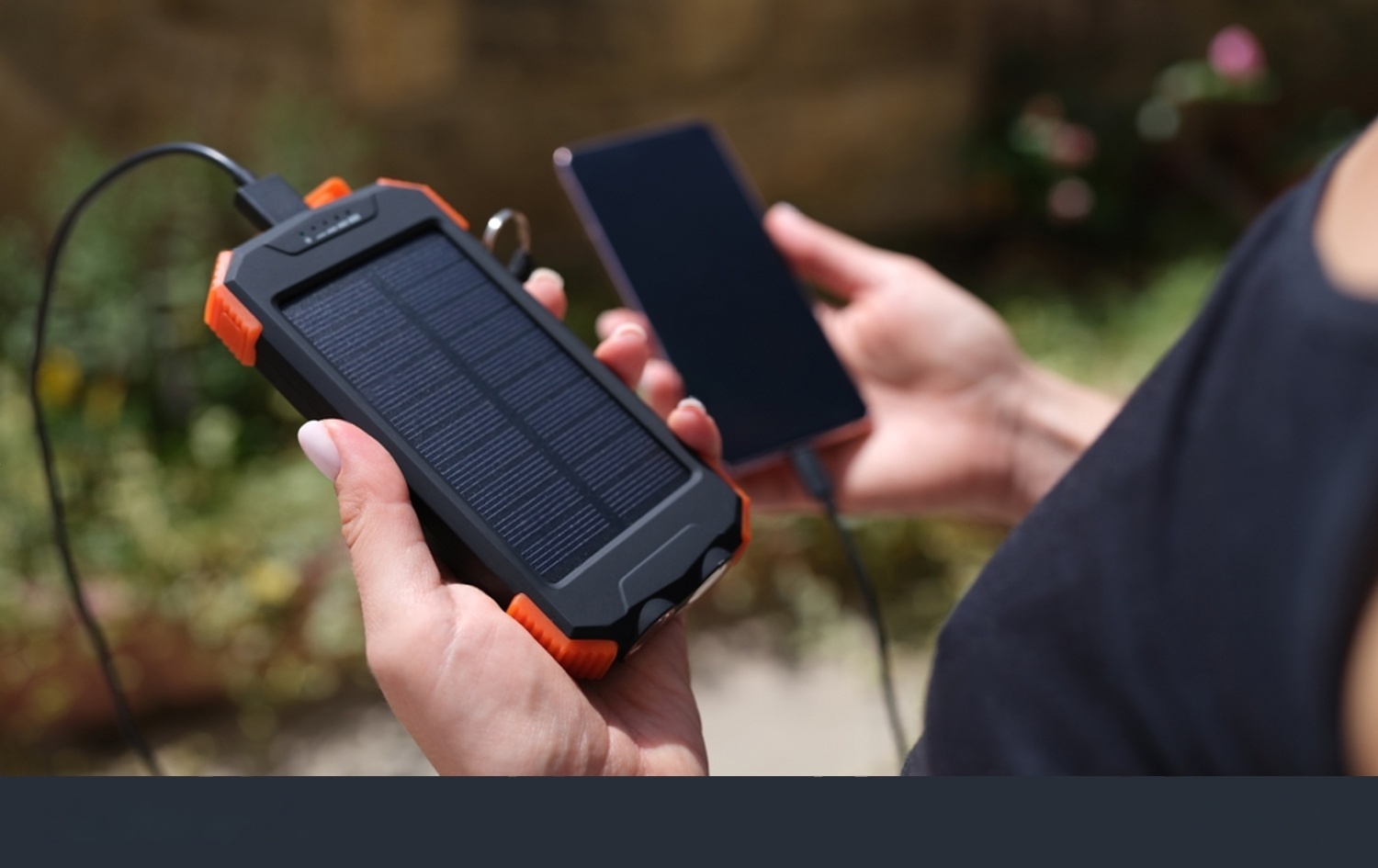 Solar power bank charging a mobile